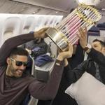 J.D. Martinez handed the World Series trophy off to Joe Kelly on Monday?s flight home from Los Angeles. 