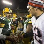 Green Bay, WI 11/30/14 Green Bay Packers quarterback Aaron Rodgers shaking hands with New England Patriots quarterback Tom Brady after they defeated the Patriots 26-21 at Lambeau Field on Sunday November 30, 2014. (Matthew J. Lee/Globe staff) Topic: Patriots Reporter: 