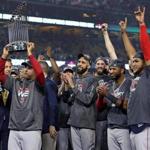 Manager Alex Cora hoisted the trophy as the Red Sox celebrated their World Series victory after Game 5. 