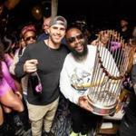 Red Sox slugger J.D. Martinez and rapper Rick Ross pose with the World Series trophy at The Grand. (Big Night Entertainment Group)