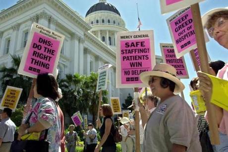 Nurses marched around the Capitol in Sacramento, Calif., in 2001 in support of a staffing ratio law to lower the number of patients per nurse in hospitals.
