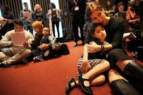 Boston, MA - November 02, 2018: Jennifer Aronson comforts her daughter Audrey, 5, during a Shabbat of Comfort, Community, and Courage at Temple Israel of Boston in Boston, MA on November 02, 2018. (This Shabbat, together with our interfaith partners and civic leaders, we will join prayer and song, as we do what we do on Shabbat: kindle light. Their presence will enable our light to shine even brighter, as we come together for a powerful Shabbat of Comfort, Community, and Courage.) (Craig F. Walker/Globe Staff) section: metro reporter:
