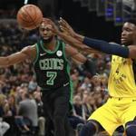Indiana Pacers guard Victor Oladipo, right, passes the basketball defended by Boston Celtics guard Jaylen Brown during an NBA basketball game, Saturday, Nov. 3, 2018, in Indianapolis. (AP Photo/R Brent Smith)