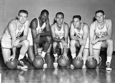 Bob Cousy (center) and Bill Russell (second from left) were teammates for seven seasons with the Celtics.
