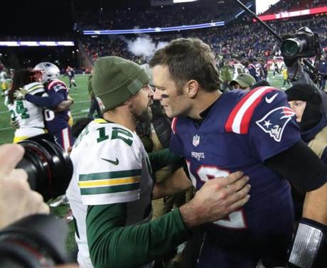 Foxborough MA 11/04/18 New England Patriots Tom Brady hugs Green Bay Packers Aaron Rogers after the Patriots defeated the Packers 31-17 at Gillette Stadium. (photo by Matthew J. Lee/Globe staff) topic: 05GlobeLive reporter: 

