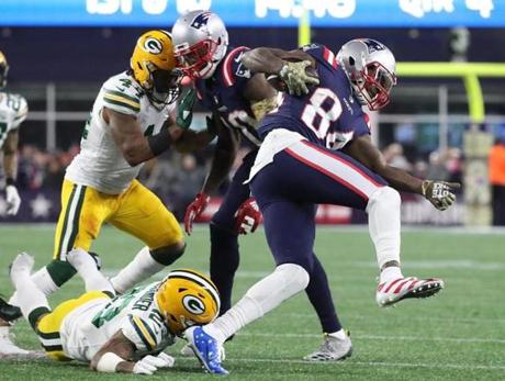 Foxborough, MA - 11/4/2018 The New England Patriots Cordarrelle Patterson is tripped up by Green Bay Packers Jaire Alexander during fourth quarter action at Gillette Stadium. (Matthew J. Lee) Globe/Staff
