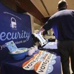 An Election Systems & Software employee demonstrated security equipment at a National Association of Secretaries of States convention in Philadelphia in July. 