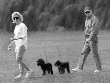 Dorchester-1988-Whitey Bulger and Catherine Greig walk together with her two poodles. BlackMassCast
