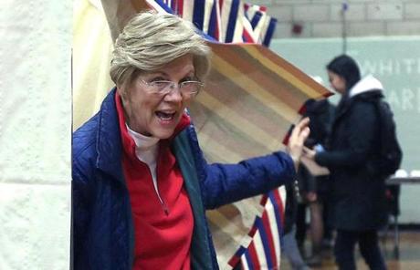 MIDTERMS SLIDER Cambridge, MA - 11/6/18 - Senator Elizabeth Warren (cq) emerges from the voting booth in Cambridge. Photo by Pat Greenhouse/Globe Staff Topic: 07senateMetro Reporter: Victoria McGrane

