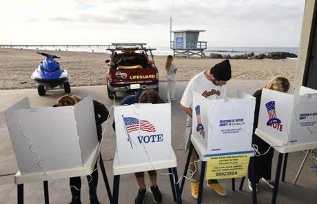 MIDTERMS SLIDER People vote during the mid-term elections beside the beach at the Venice Beach Lifeguard station in California on November 6, 2018. - Americans started voting Tuesday in critical midterm elections that mark the first major voter test of US President Donald Trump's controversial presidency, with control of Congress at stake. (Photo by Mark RALSTON / AFP)MARK RALSTON/AFP/Getty Images
