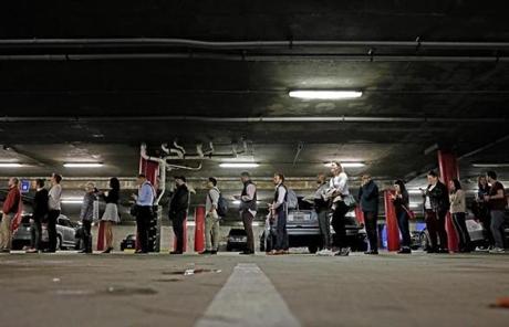 MIDTERMS SLIDER A line backs up into a parking garage outside a polling site on election day in Atlanta, Tuesday, Nov. 6, 2018. (AP Photo/David Goldman)
