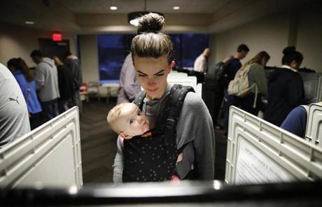 MIDTERMS SLIDER Kristen Leach votes with her six-month-old daughter, Nora, on election day in Atlanta, Tuesday, Nov. 6, 2018. (AP Photo/David Goldman)
