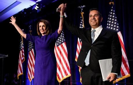 MIDTERMS SLIDER2 House Minority Leader Nancy Pelosi (D-CA) and Representative Ben Ray Lujan (D-MN), DCCC Chairman, celebrate a projected Democratic Party takeover of the House of Representatives during a midterm election night party hosted by the Democratic Congressional Campaign Committee on November 7, 2018 in Washington, DC. (Photo by Brendan Smialowski / AFP) / ALTERNATIVE CROPBRENDAN SMIALOWSKI/AFP/Getty Images
