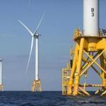 In this Aug. 15, 2016 , three of Deepwater Wind's turbines stand in the water off Block Island, R.I. Providence, R.I.,-based Deepwater Wind announced Monday, Oct. 8, 2018, that the Danish offshore wind company Orsted has entered into an agreement to buy it. The agreement must be approved by federal regulators.