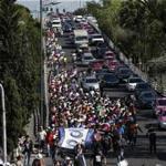 Central American migrants marched Thursday to the United Nations office in Mexico City to demand buses to the US border. 