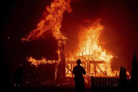 A home burns as the Camp Fire raged through Paradise, Calif.
