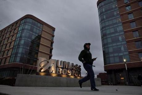 A student walked by the new dorms at the University of Massachusetts in Boston on Friday.
