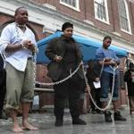 Kevin Peterson (left), Celestina Crenshaw, and Avonte Dabney portrayed slaves during?s Saturday?s reenactment at Faneuil Hall.