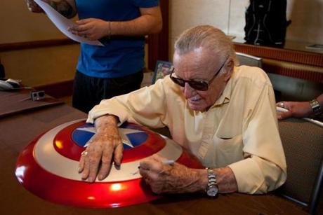 Boston, MA -- 08/01/15 -- Legendary comic artist Stan Lee signs a Captain America prop for a fan during the Boston Comic Con, held at the Seaport World Trade Center, on August 1, 2015, in Boston, Massachusetts. (Kayana Szymczak for the Boston Globe)
