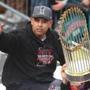 PARADE SLIDER Boston10/31/18 Manager Alex Cora waves with the trophy during the Boston Red Sox World Series victory parade down Boylston Street as players and staff filled duckboats to cheering fans lining the streeet. Photo by John Tlumacki/Globe Staff(sports)