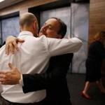 Peter DeMarco (left) and Dr. Assaad Sayah, chief medical officer for Cambridge Health Alliance, embraced Tuesday.