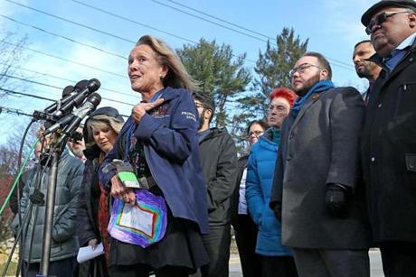Hemenway Elementary School principal Liz Simon spoke to the media while holding a message of support and love from one of her students.  
