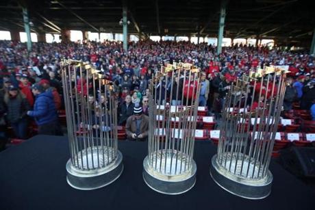 BOSTON, MA - 10/31/2018 - World Championship trophies sit on the Red Sox dugout before the ceremony inside Fenway Park before the Duck Boat parade. (Stan Grossfeld/Globe staff)

