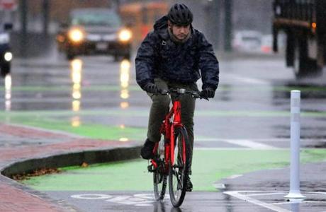 Boston, MA - 11/13/18 - A cyclist braves the elements in heavy rain on Commonwealth Avenue. (Lane Turner/Globe Staff) Reporter: () Topic: (14rain)

