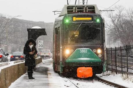 Boston, Massachusetts - 1/4/2018 - An MBTA green line train moves through the snow on Commonwealth Avenue in Boston, Massachusetts, January 4, 2018. (Keith Bedford/Globe Staff)
