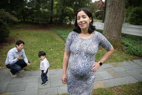 10/20/2018 Wellesley Ma- Yeimy Garcia (cq) is a working mother. She is photographed at her home in Wellesley with her family. Her husband Ronald Li (cq) and her son Oliver Li (cq) both at left. Jonathan Wiggs /Globe Staff Reporter:Topic: 
