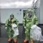 Members of the hazmat team investigated on the roof of the hotel. 
