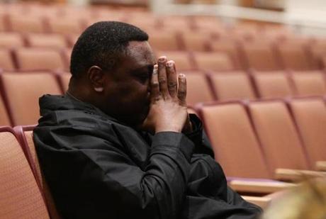 Reading MA 11/13/18 Father Lambert Nieme a priest at Saint Agnes Parish listening during a town select meeting discussing issues of racist graffiti found around town at Reading Memorial High School, Performing Arts Center. (photo by Matthew J. Lee/Globe staff) topic: reporter: 
