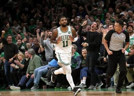 Boston, MA - 11/16/2018 - (OT) Boston Celtics guard Kyrie Irving (11) brought the fans to their feet after his jumper gave the Celtics a 119-112 lead during overtime. The Boston Celtics host the Toronto Raptors at TD Garden. - (Barry Chin/Globe Staff), Section: Sports, Reporter: Adam Himmelsbach, Topic: 17Celtics-Raptors, LOID: 8.4.3836869140.
