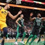 Boston MA 11/17/18 Boston Celtics Kyrie Irving and Marcus Morris battle for a defensive rebound in front of Utah Jazz Rudy Gobert during second quarter action at TD Garden. (photo by Matthew J. Lee/Globe staff) topic: reporter: 