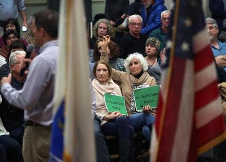 Some at US Representative Seth Moulton?s town hall-style meeting in Amesbury Monday held signs backing Nancy Pelosi.
