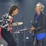 FILE - In this May 25, 2018 file photo, Mick Jagger, left, and Keith Richards, of The Rolling Stones, perform during their No Filter tour in London. The Rolling Stones will be rolling through the U.S. next year. The band says it is adding a 13-show leg to its tour in spring 2019, kicking off in Miami on April 20. (Photo by Mark Allan/Invision/AP, File)