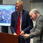 Former Massachusetts governors William Weld (left) and Michael Dukakis united again Monday to restate their support for the North-South Rail Link.