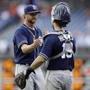 San Diego Padres' Colten Brewer, left, celebrates with Austin Hedges after winning the first baseball game of a doubleheader against the Philadelphia Phillies, Sunday, July 22, 2018, in Philadelphia. (AP Photo/Matt Slocum)