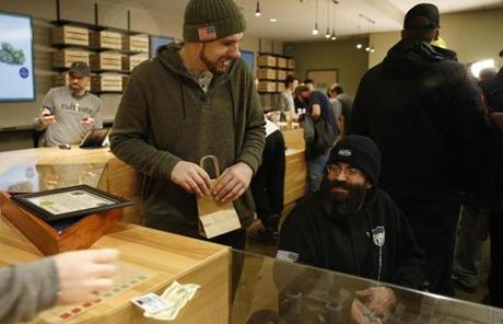 LEGAL POT SLIDER Leicester, MA, 11/19/2018 -- Iraq veterans Justin Moreau (L) and Nick Ash who served in both Iraq and Afghanistan purchase marijuana at the opening of Cultivate, one of the state's first two pot shops. This the first day the store can sell recreational marijuana to adults 21 and older. (Jessica Rinaldi/Globe Staff) Topic: 21potopen Reporter: 
