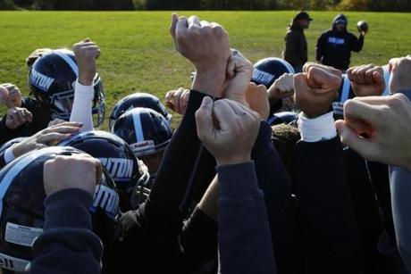 Byfield, MA - 10/22/2018- ] Triton High School football team calls a huddle before practice on Monday. (Michael Swensen for The Boston Globe) Topic: (Sports)
