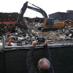 Boston, MA, 11/21/2018 -- Tom Egan of Dorchester takes pictures of the now demolished Whiskey Priest in the Seaport District. (Jessica Rinaldi/Globe Staff) Topic: Reporter: 