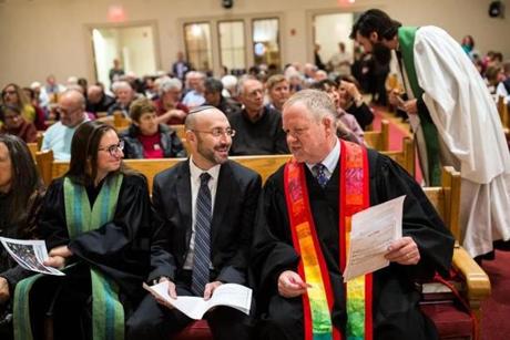 Rabbi David Lerner (center) of Temple Emunah joined Rev. Paul Shupe during an interfaith service in Lexington. 

