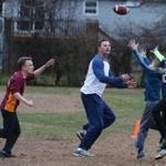 Mystic, CT - 11/18/2018- ] William Korinek, CEO of Astrocyte Pharmaceuticals, plays tag football at ST Butler Elementary School in Mystic with his two sons and longtime friends on Sunday, November 19, 2018. Korinek and Astrocyte Pharmaceuticals are now developing a drug to treat concussions. (Michael Swensen for The Boston Globe) Topic: (business)