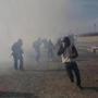 Migrants ran after US agents launched tear gas on Sunday at the US-Mexico border.