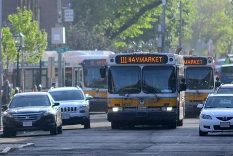A trio of Route 111 buses formed a convey down Broadway Street in Chelsea as they headed toward Boston.
