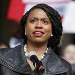 FILE - In this Oct. 1, 2018 file photo, Boston City Councilor Ayanna Pressley speaks at a rally at City Hall in Boston. On Nov. 6, Pressley became Massachusetts' first black woman elected to the U.S. House of Representatives. (AP Photo/Mary Schwalm, File)