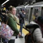 11/28/2018 East Boston Ma- Blue Line passengers at the MBTA Maverick Square Station. Jonathan Wiggs /Globe Staff Reporter:Topic: 