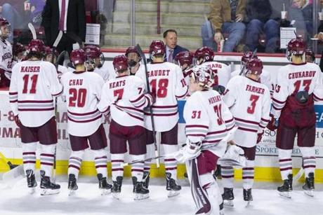 Umass Amherst hockey head coach Greg Carvel (C) has a talk with his team during a break in the game against Princeton in the second period at the Mullins Center in Amherst, Massachusetts on November 24, 2018. UMass defeated Princeton 3-2 in overtime. Matthew Healey for The Boston Globe

