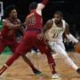 Boston, MA - 11/30/2018 - (1st quarter) Boston Celtics guard Kyrie Irving (11) drives past Cleveland Cavaliers forward Cedi Osman (16) and Cleveland Cavaliers guard Collin Sexton (2) during the first quarter. The Boston Celtics host the Cleveland Cavaliers at TD Garden. - (Barry Chin/Globe Staff), Section: Sports, Reporter: Adam Himmelsbach, Topic: 01Celtics-Cavaliers, LOID: 8.4.3975933757.