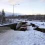 A car was trapped on a collapsed section of the offramp in Anchorage on Friday.
